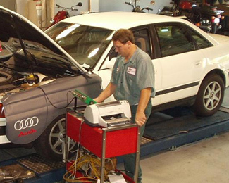 Mechanic Repairing an Audi in Our Alpharetta, GA Shop